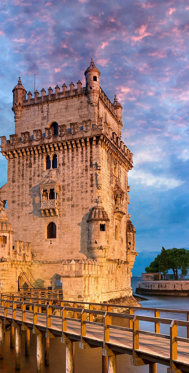 Belem Tower at sunset with reflection