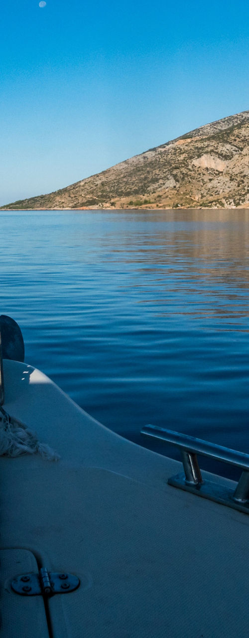 Boat cruising on calm blue waters