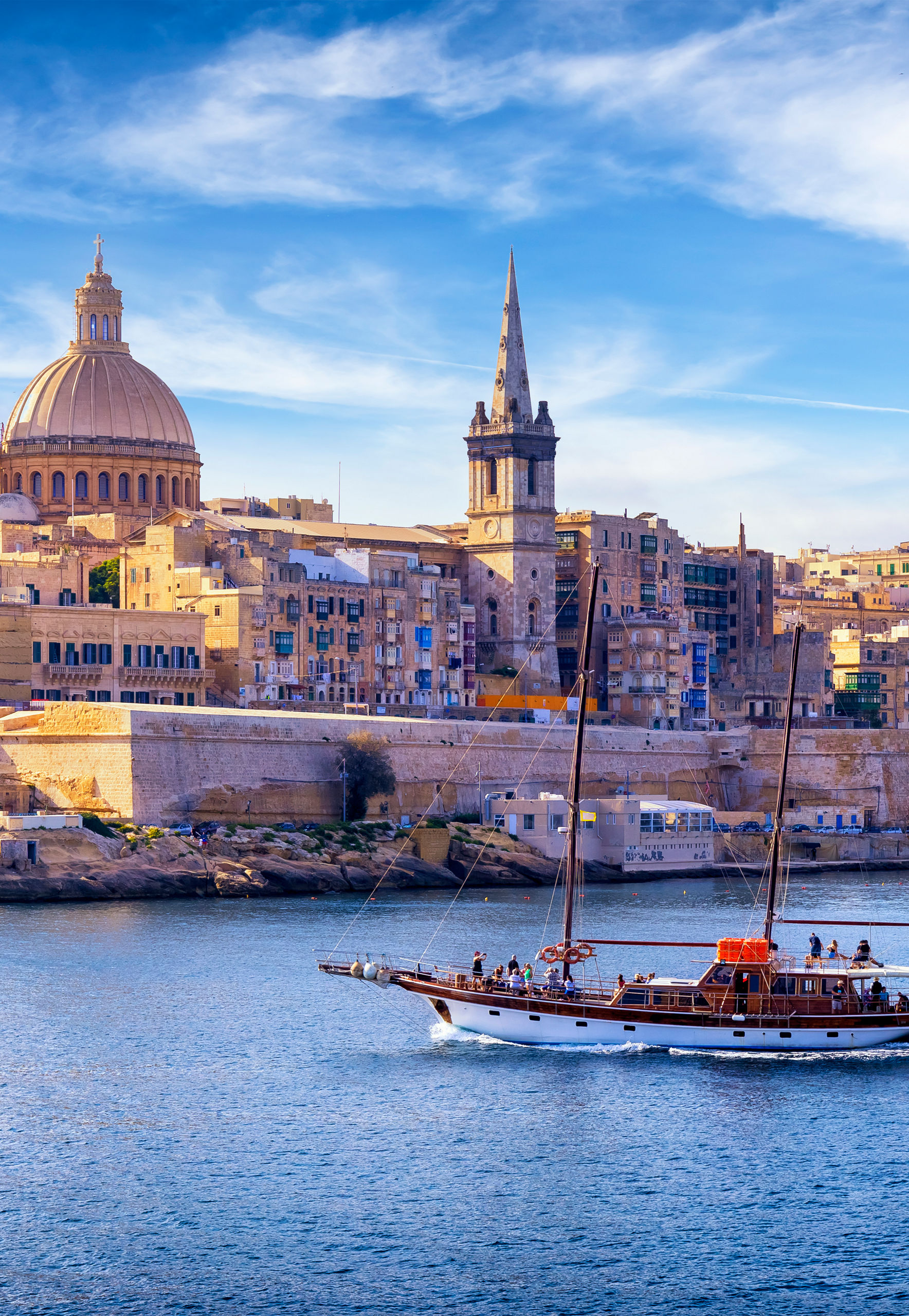 Sailboat in Valletta with historic skyline