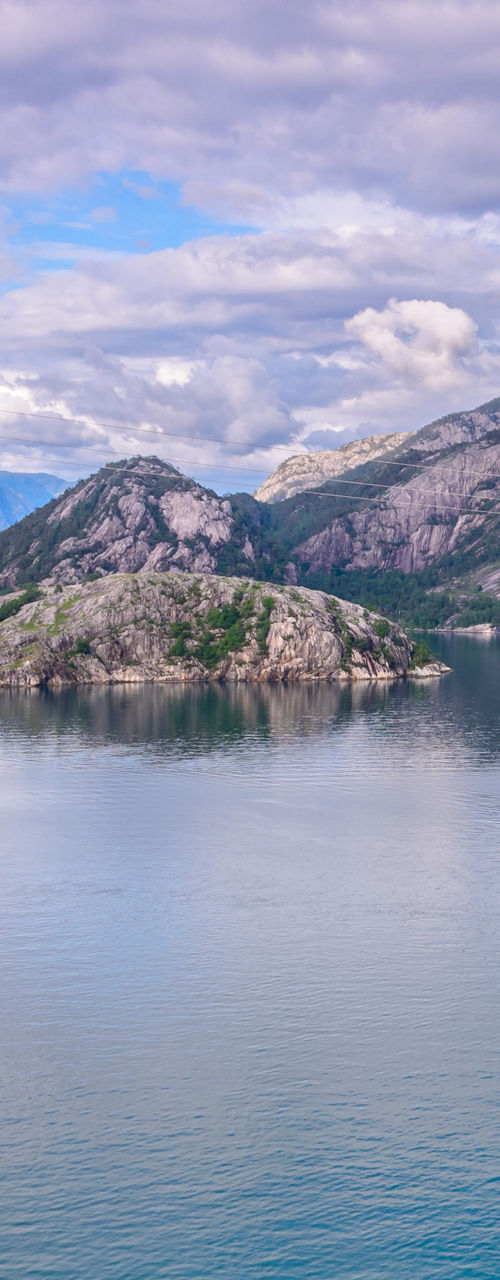 Scenic fjord with boat and mountains