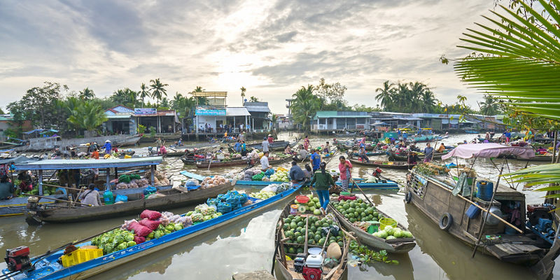 Bustling floating market with colorful produce