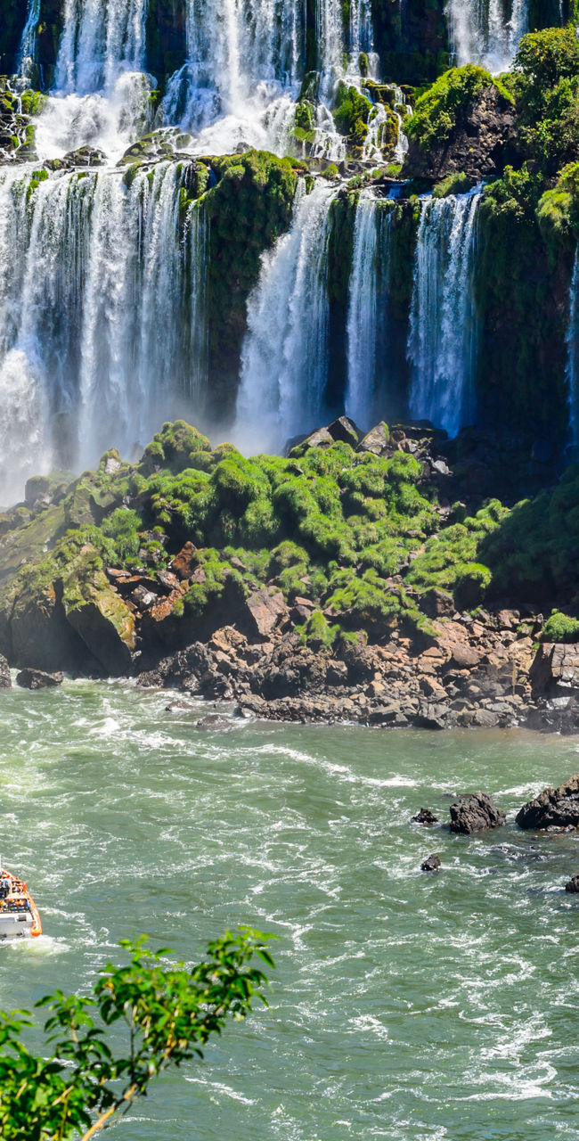 Majestic Iguazu Falls with boat in view