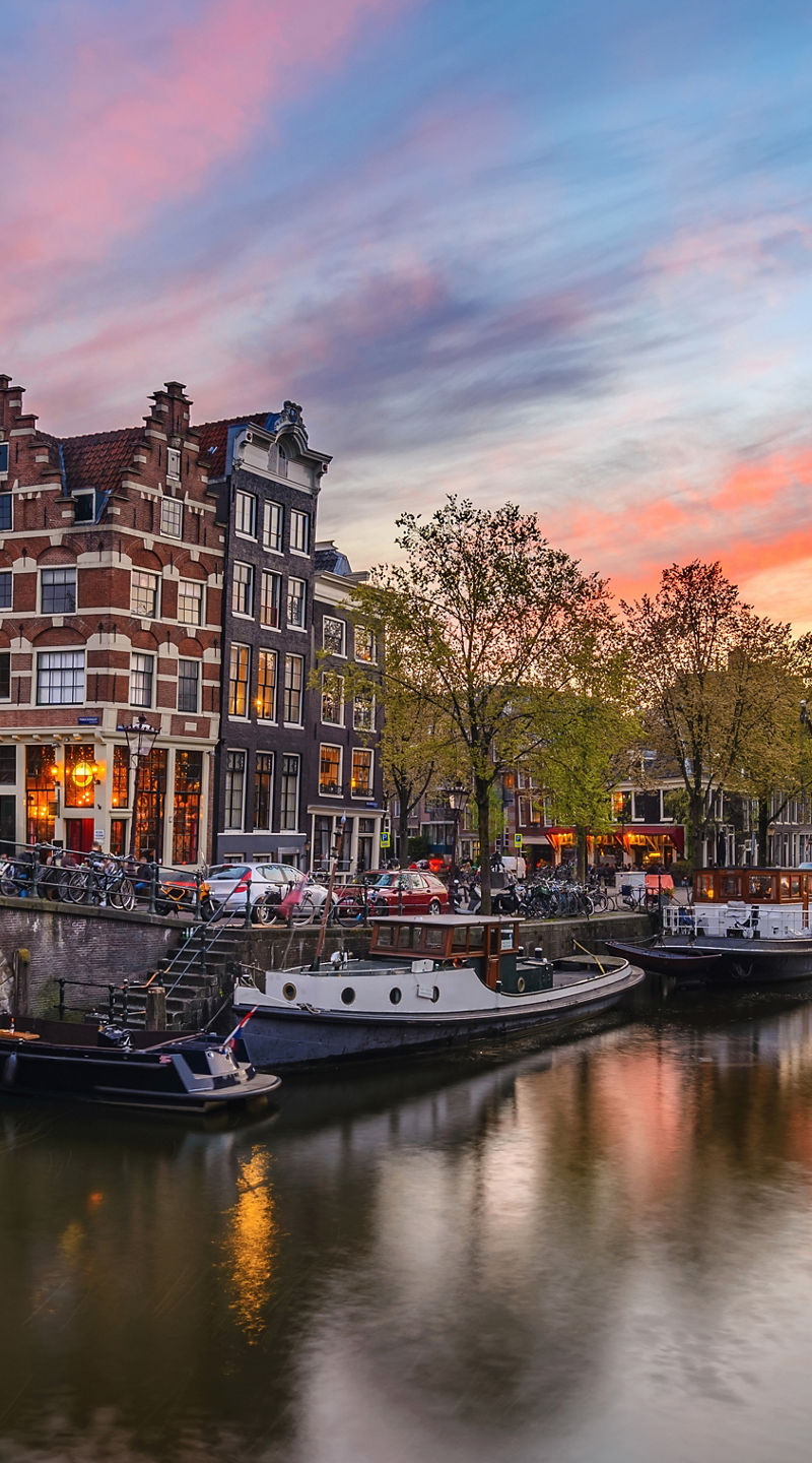 Scenic Amsterdam canal at sunset