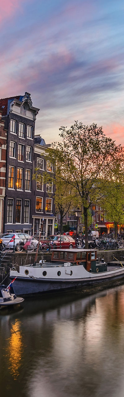 Scenic Amsterdam canal at sunset