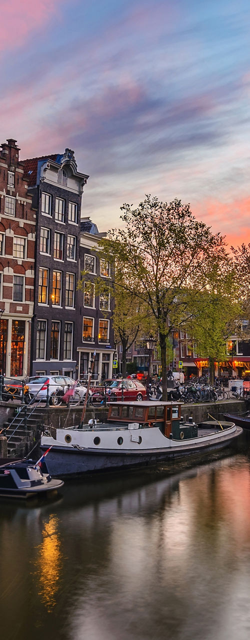 Scenic Amsterdam canal at sunset