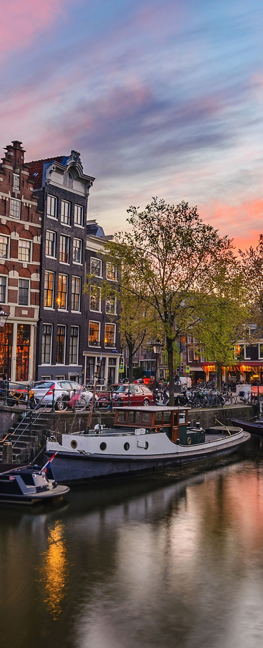 Scenic Amsterdam canal at sunset