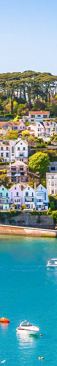 Scenic coastal village with sailboats