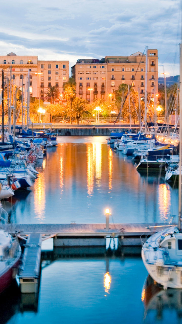 Scenic marina with docked sailboats at dusk