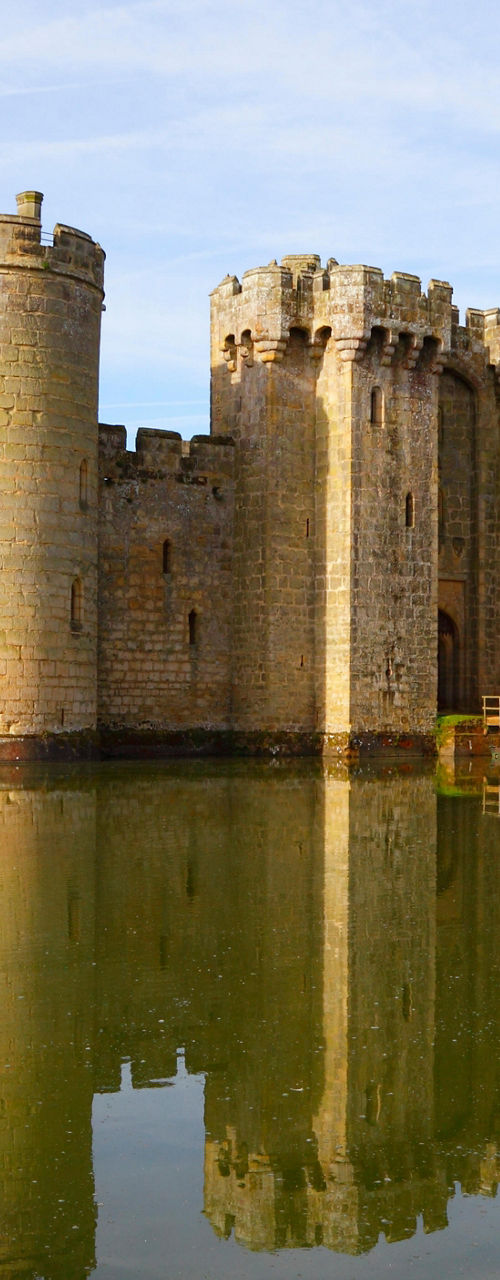 Historic stone castle surrounded by water