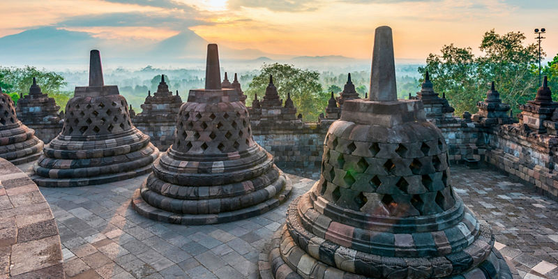 Borobudur temple at sunrise with mountain view