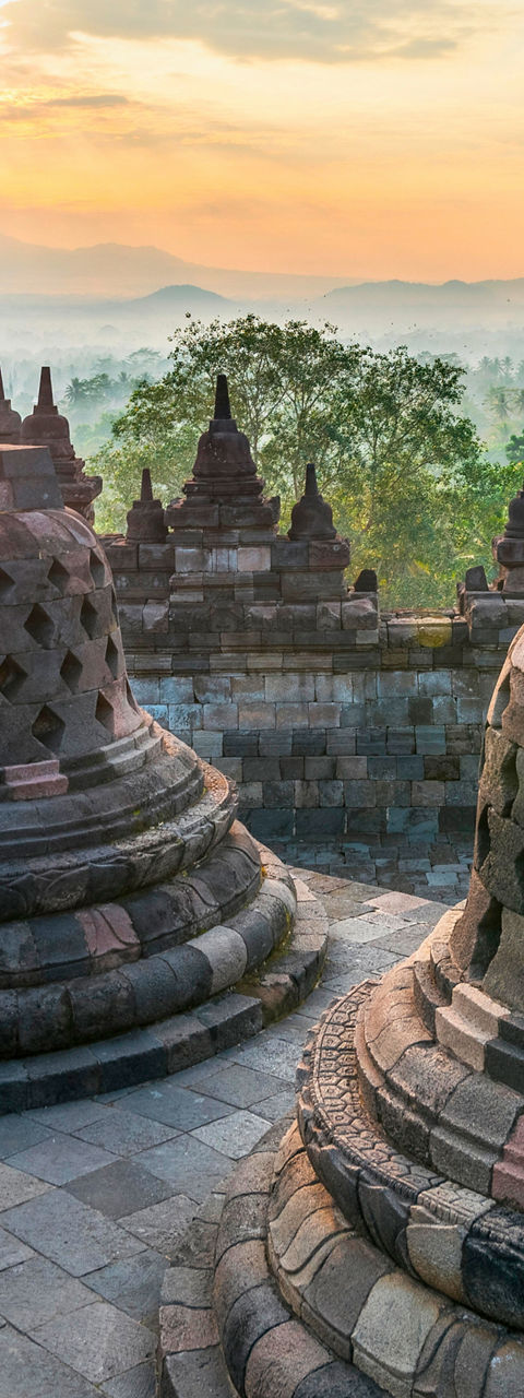 Borobudur temple at sunrise with mountain view