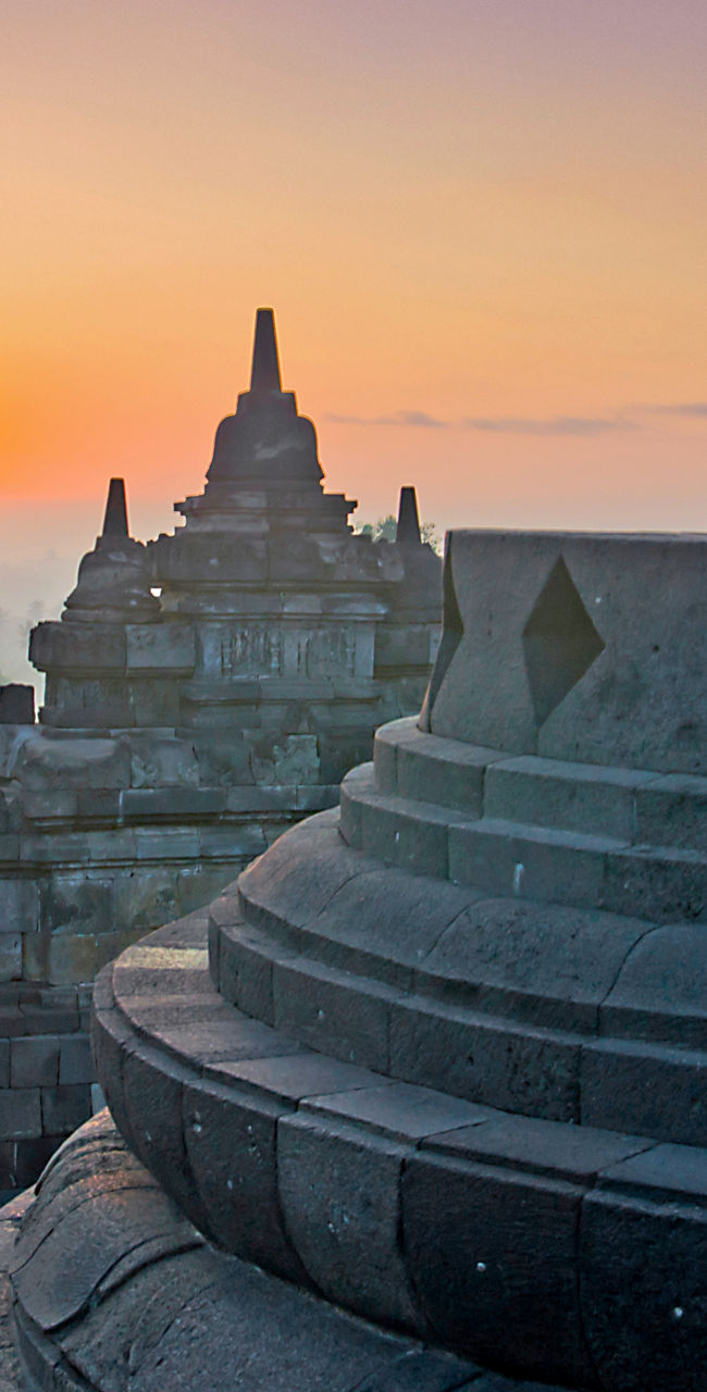 Sunrise at Borobudur Temple with Buddha statue