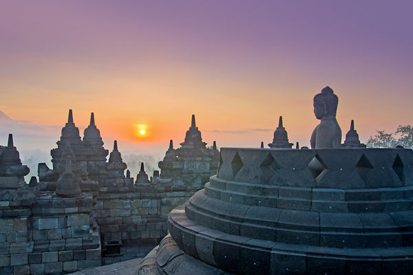 Sunrise at Borobudur Temple with Buddha statue