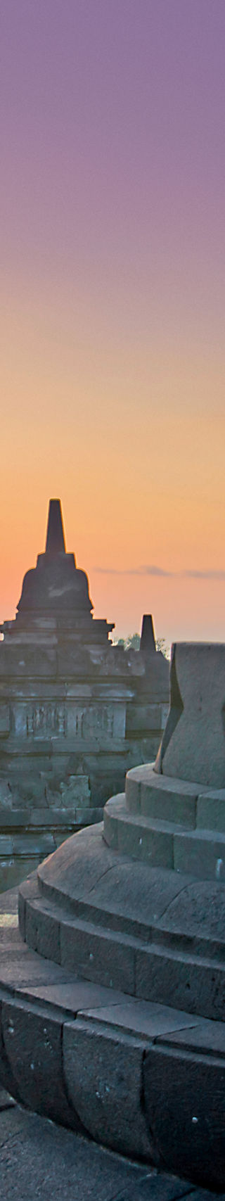 Sunrise at Borobudur Temple with Buddha statue