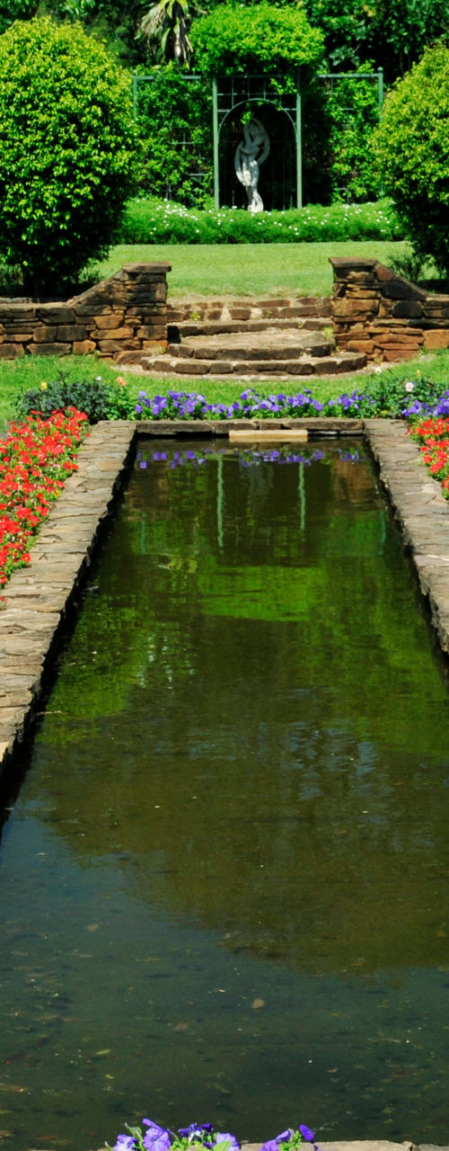 Symmetrical garden with vibrant flower beds