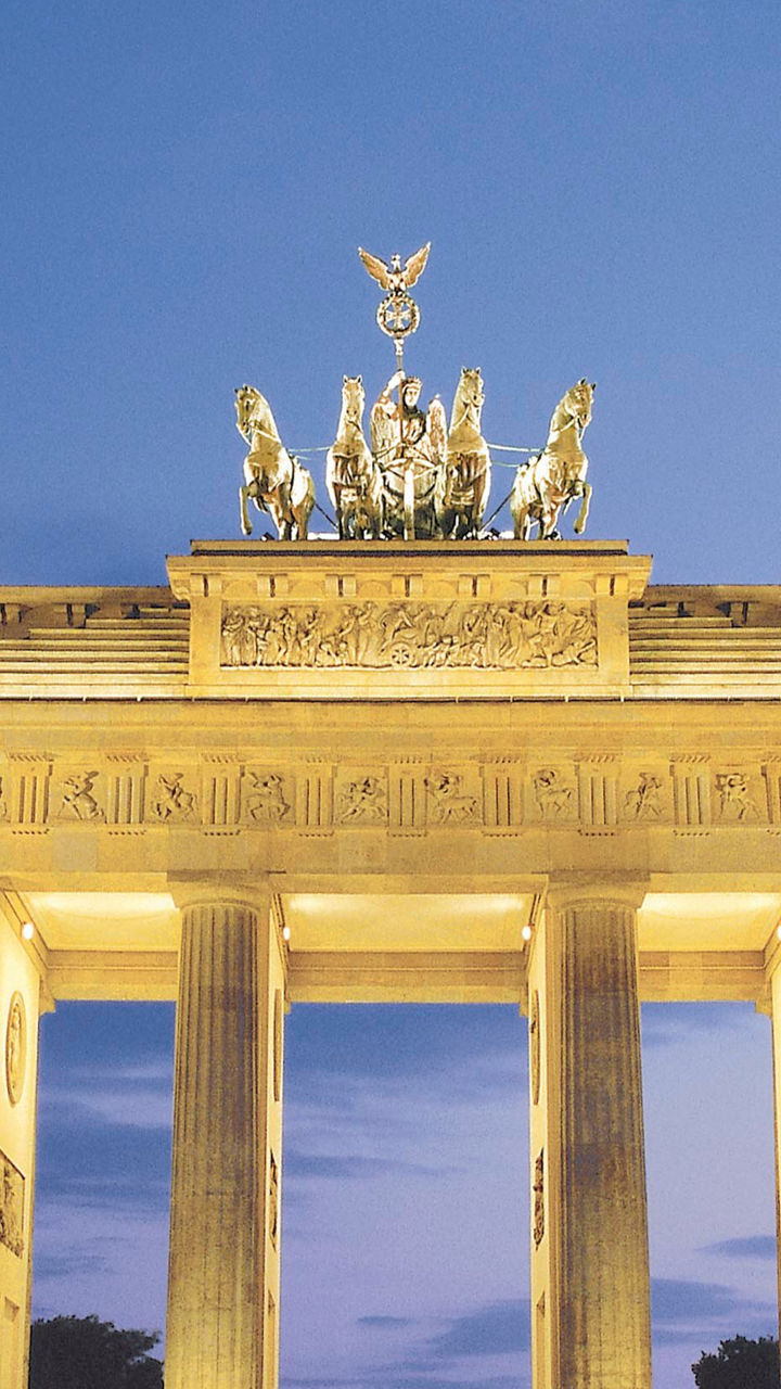 Brandenburg Gate illuminated at dusk