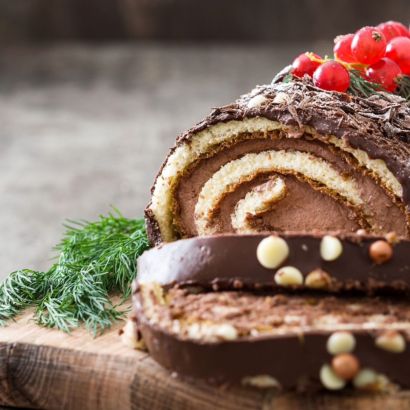 Chocolate Swiss roll with berries and garnish