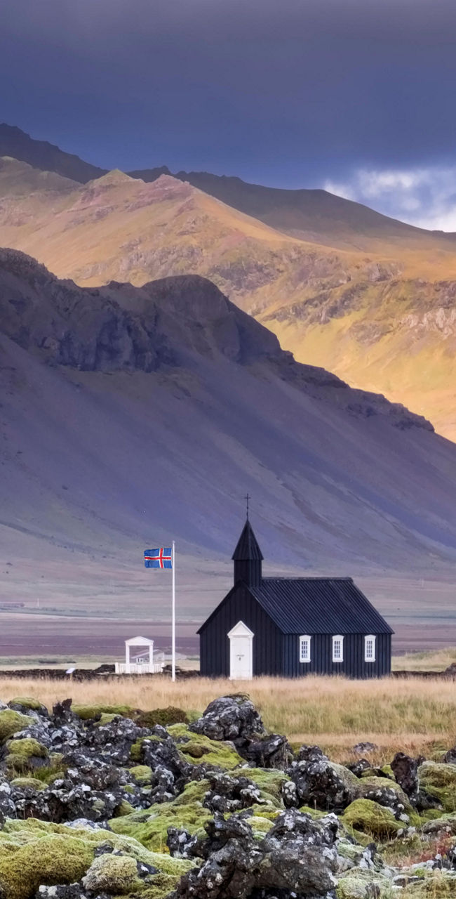Black church in Icelandic volcanic landscape