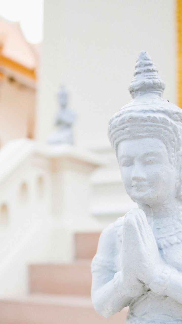 White statue in traditional Thai temple