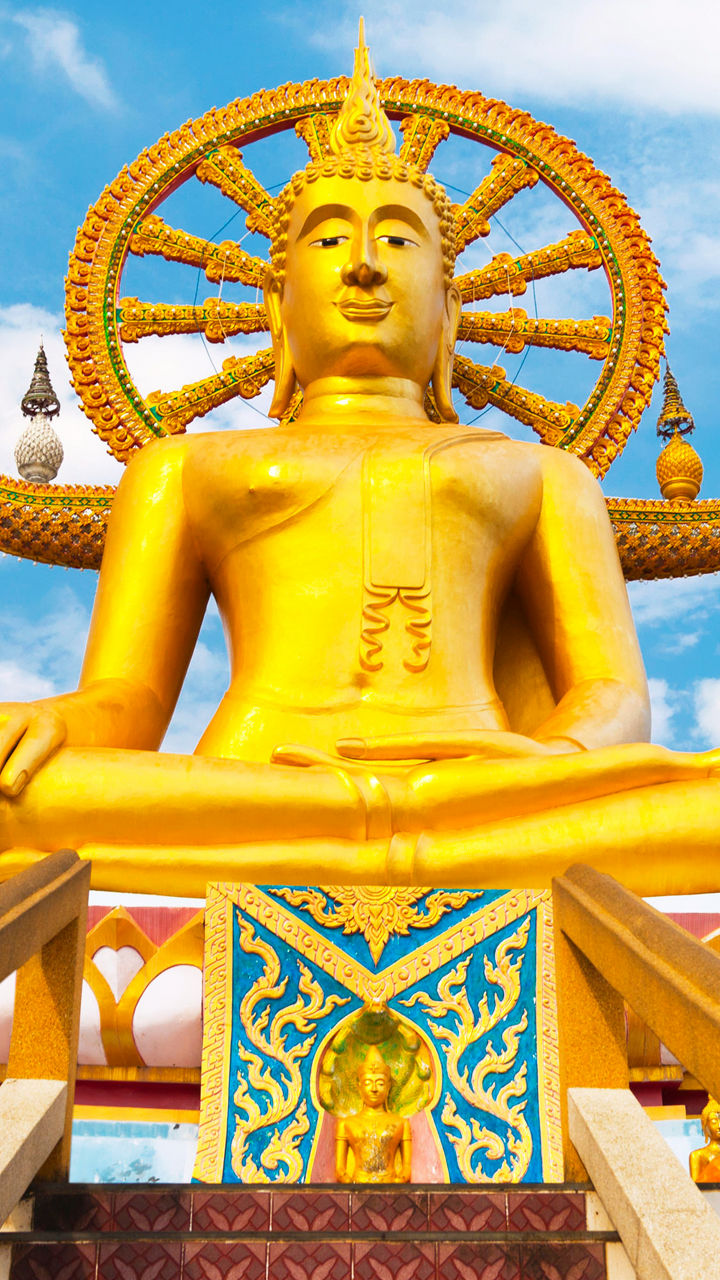 Golden Buddha statue with ornate details