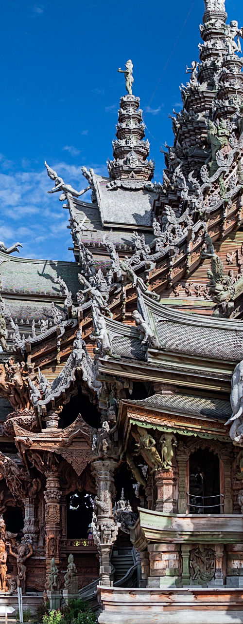 Intricate Wooden Temple Under Blue Sky