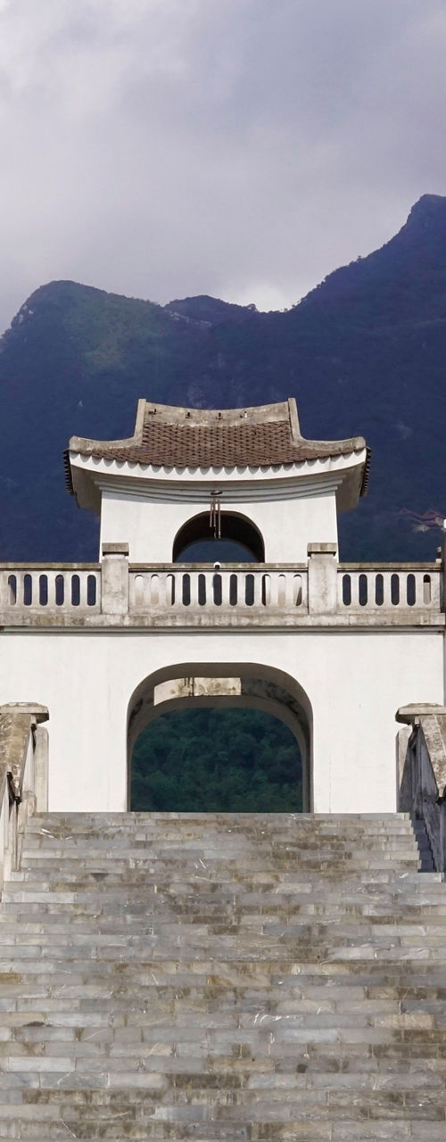 Traditional Chinese architecture with mountain backdrop