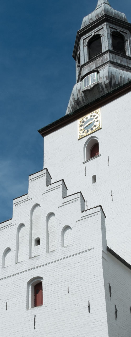 Historic white church with clock tower