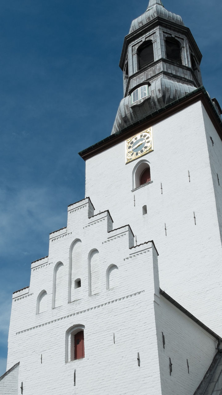 Historic white church with clock tower