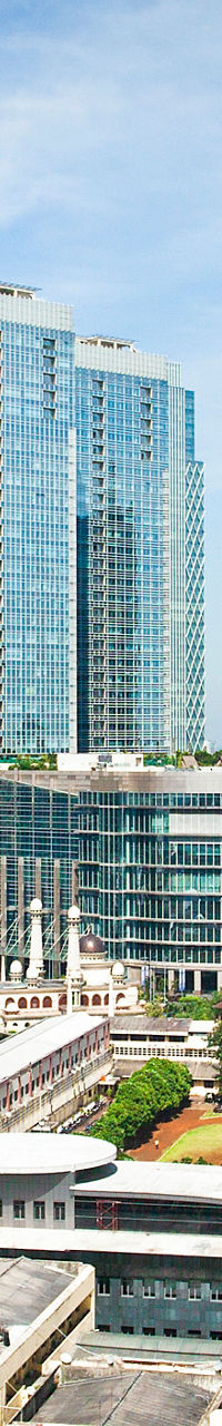Modern cityscape with skyscrapers and greenery