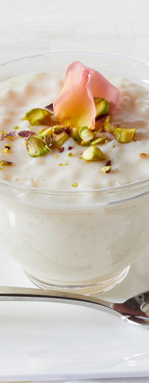 Glass bowl of dessert with pistachios