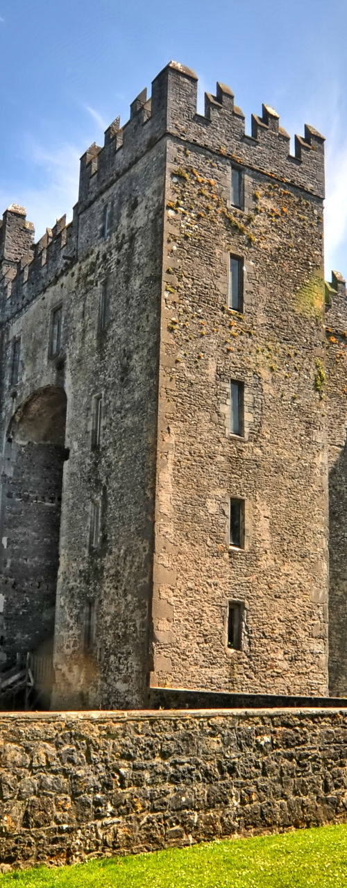 Historic stone castle under blue sky