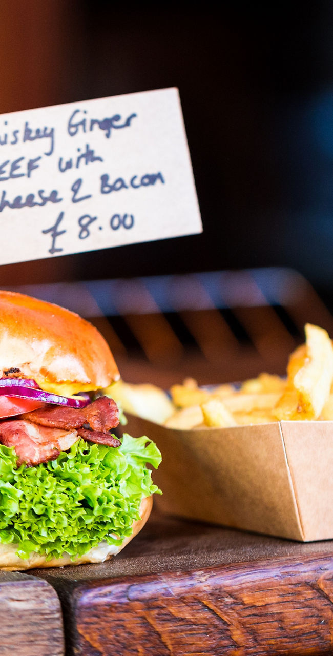 Gourmet burgers and fries on display
