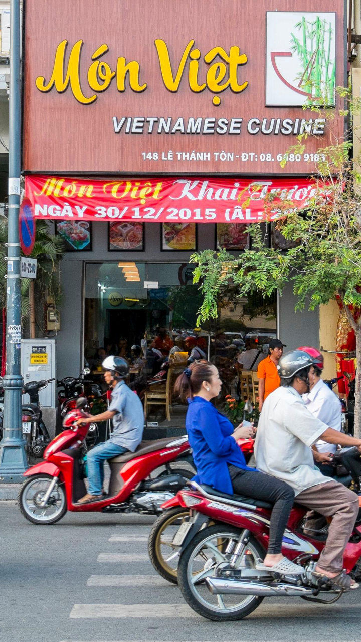 Vietnamese street scene with shops and traffic