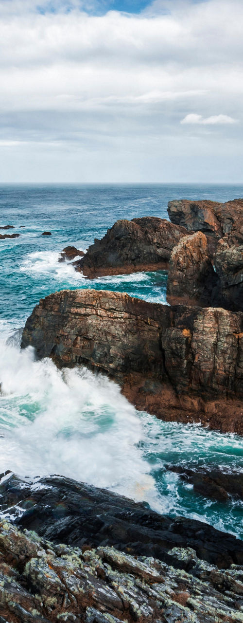 Coastal lighthouse overlooking rocky cliffs