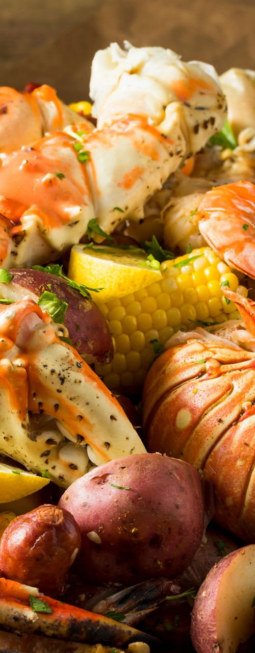 Seafood boil with crab, shrimp, and corn