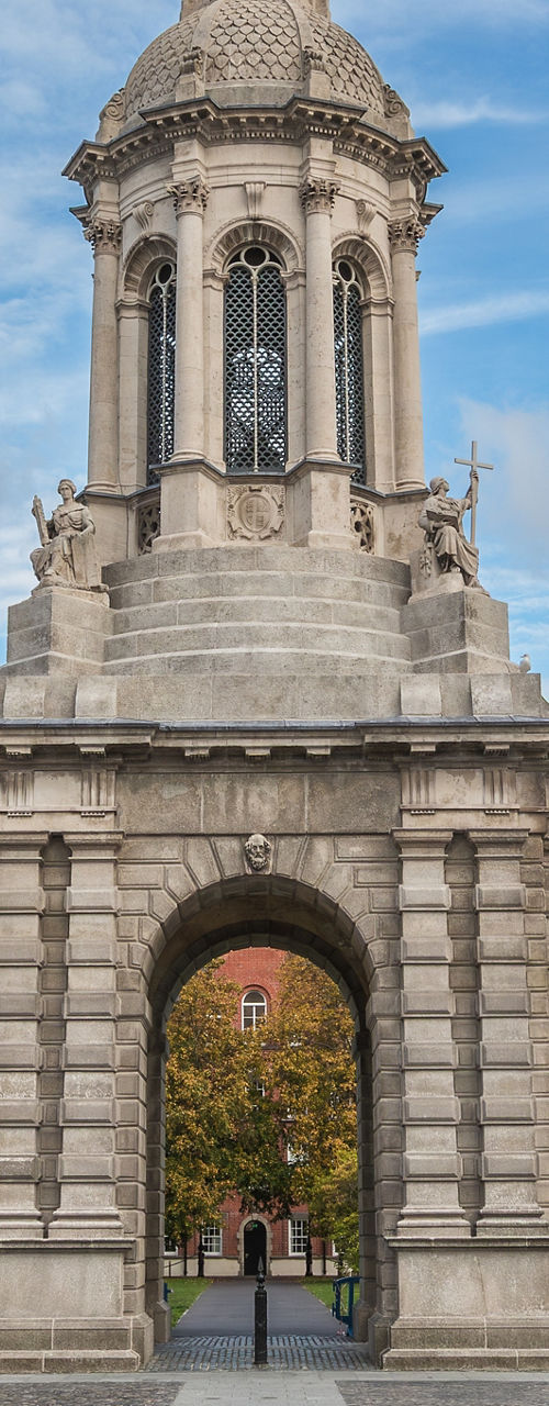 Historic stone bell tower in university courtyard