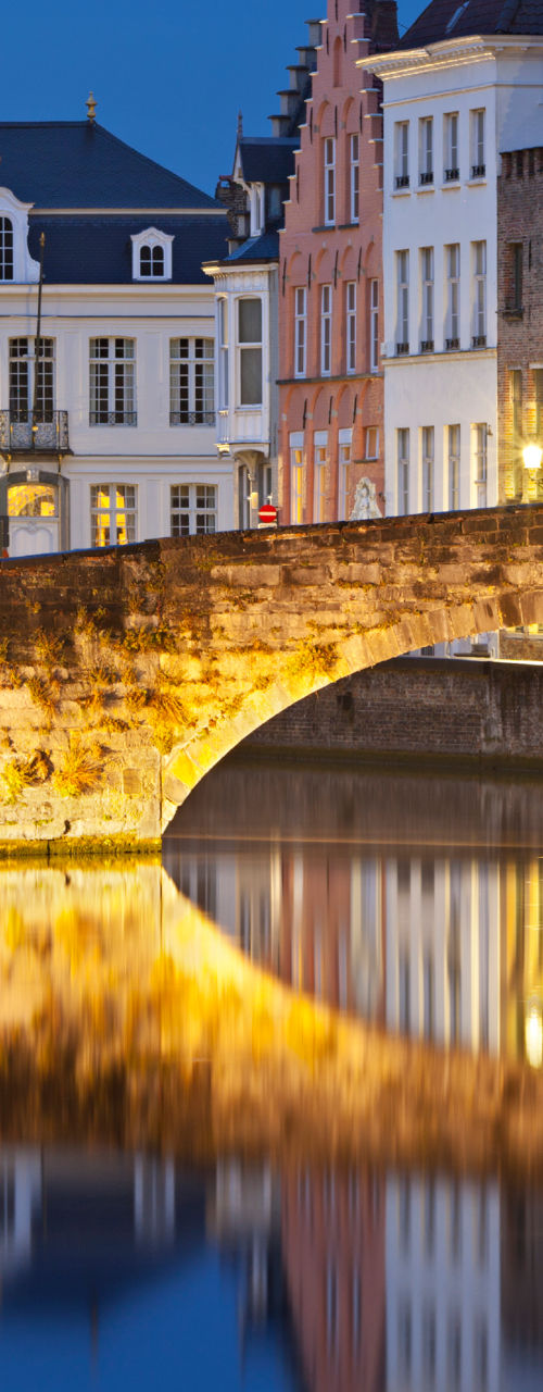 Historic bridge over canal at dusk