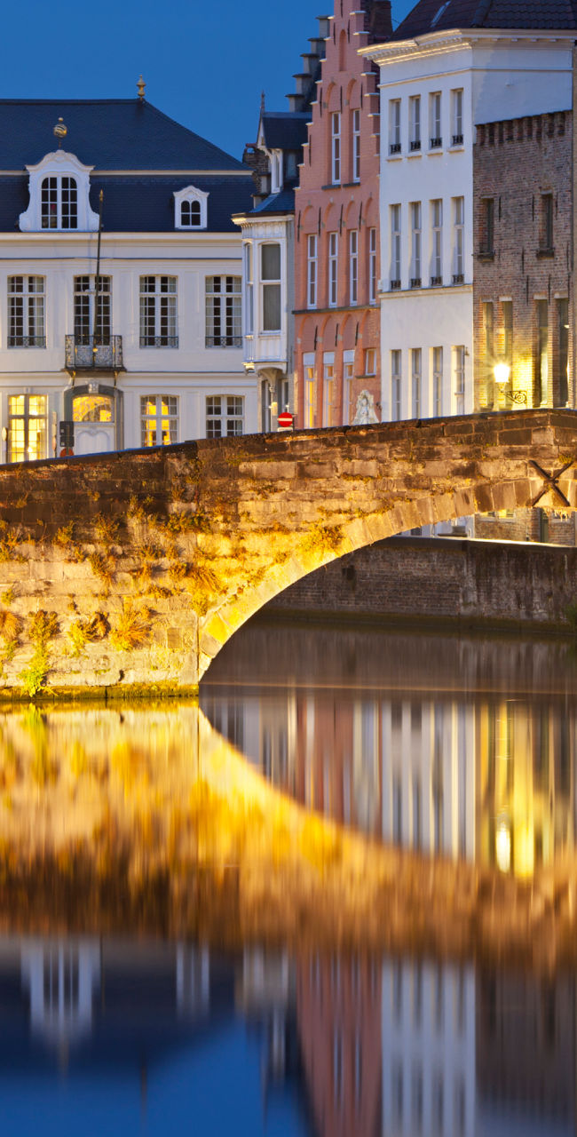 Historic bridge over canal at dusk