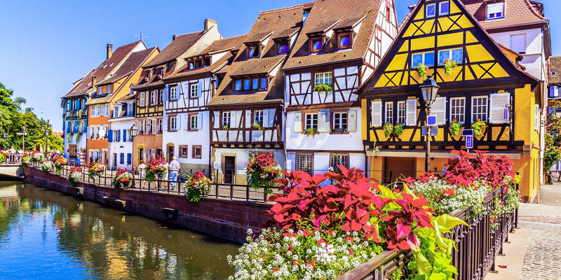 Colorful half-timbered houses by canal