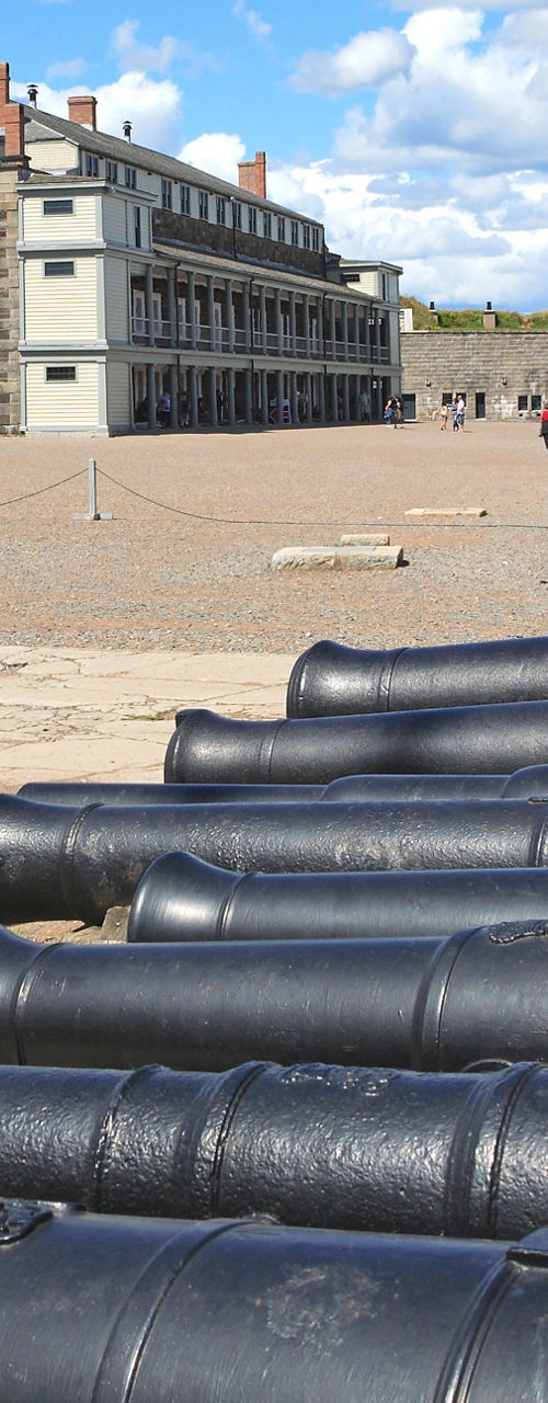 Historic fort with lined cannons outdoors