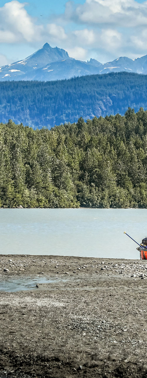 Red canoes on a serene mountain lake