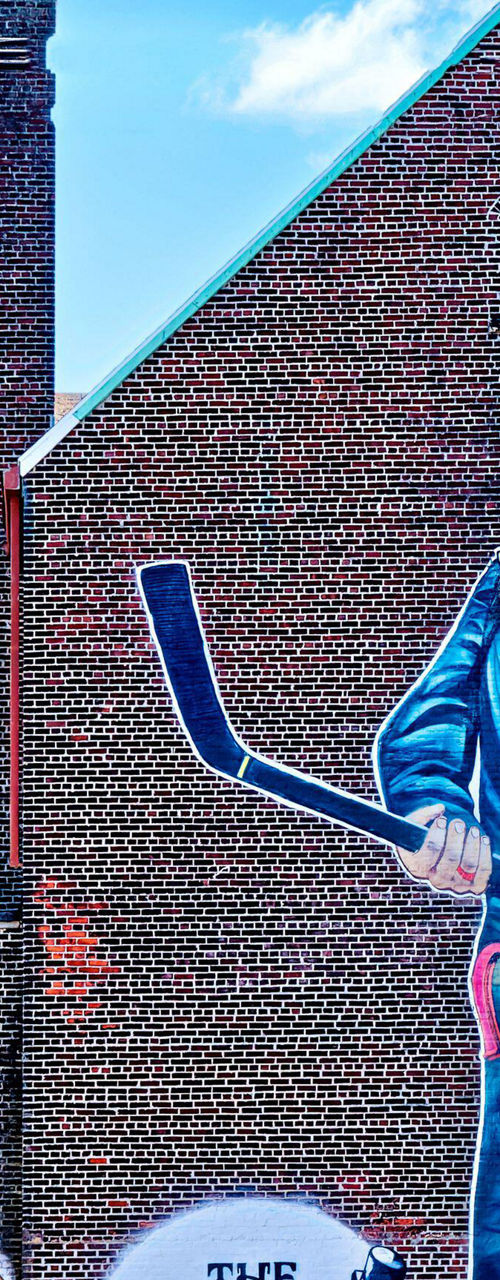 Large hockey mural on brick building