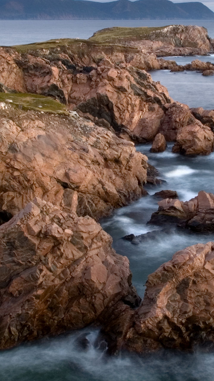Rocky coastal cliffs at sunset