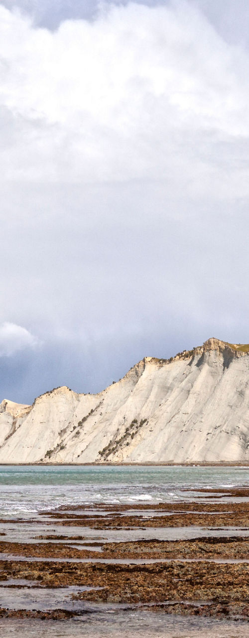 Scenic coastal cliffs under cloudy sky