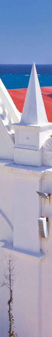 White coastal church with red roof
