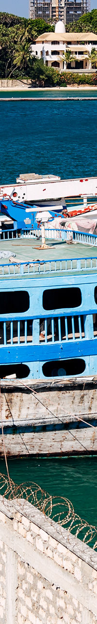 Traditional wooden boats docked at harbor