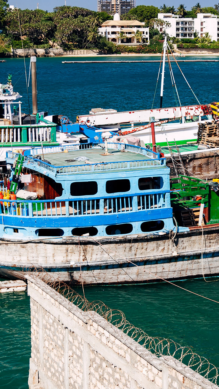 Traditional wooden boats docked at harbor