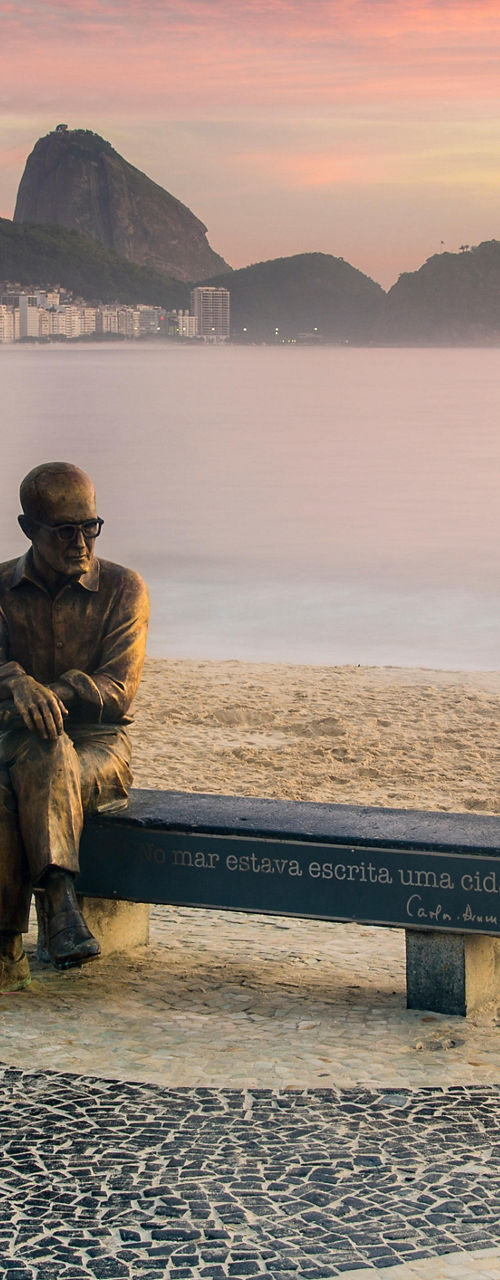Statue on Copacabana Beach at sunrise
