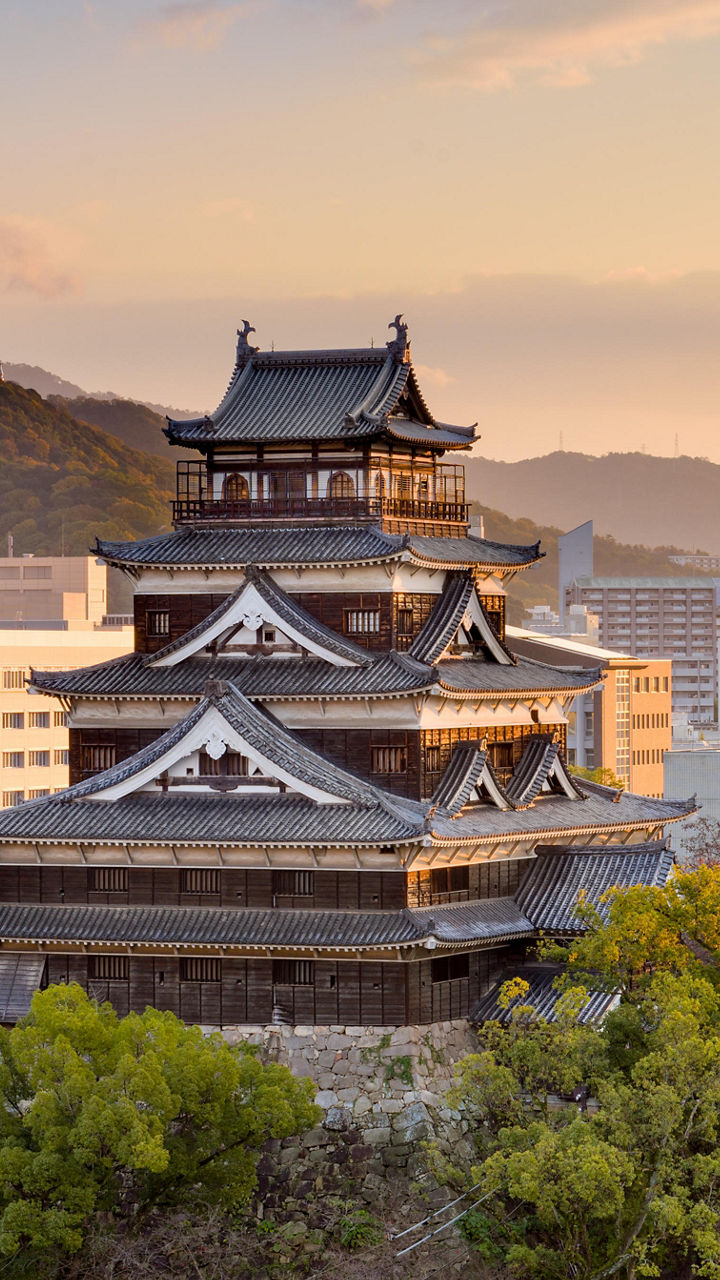 Hiroshima Castle at sunset with cityscape