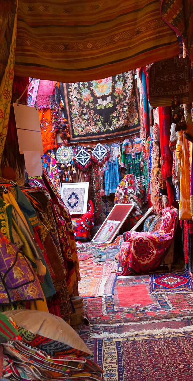 Colorful textile market with vibrant rugs